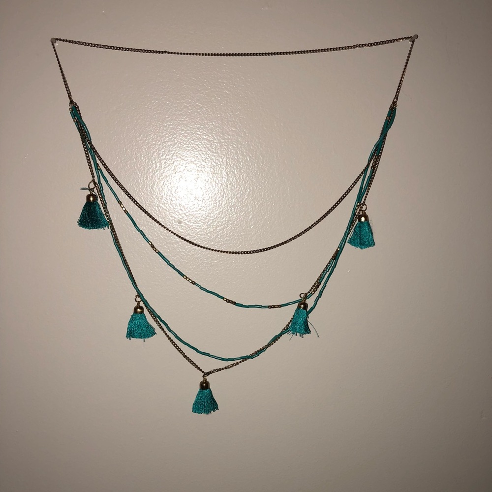 gold and turquoise necklace with tassels